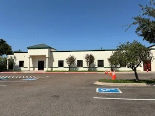 Cream-colored commercial building with painted trim and updated exterior finish